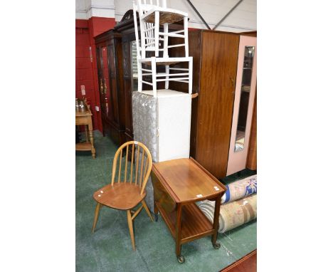 A large vintage style ottoman; an Ercol style chair; a mahogany dropleaf tea trolley; two white painted chairs