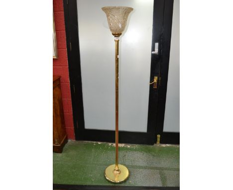 A contemporary gilt metal up-light standard lamp.