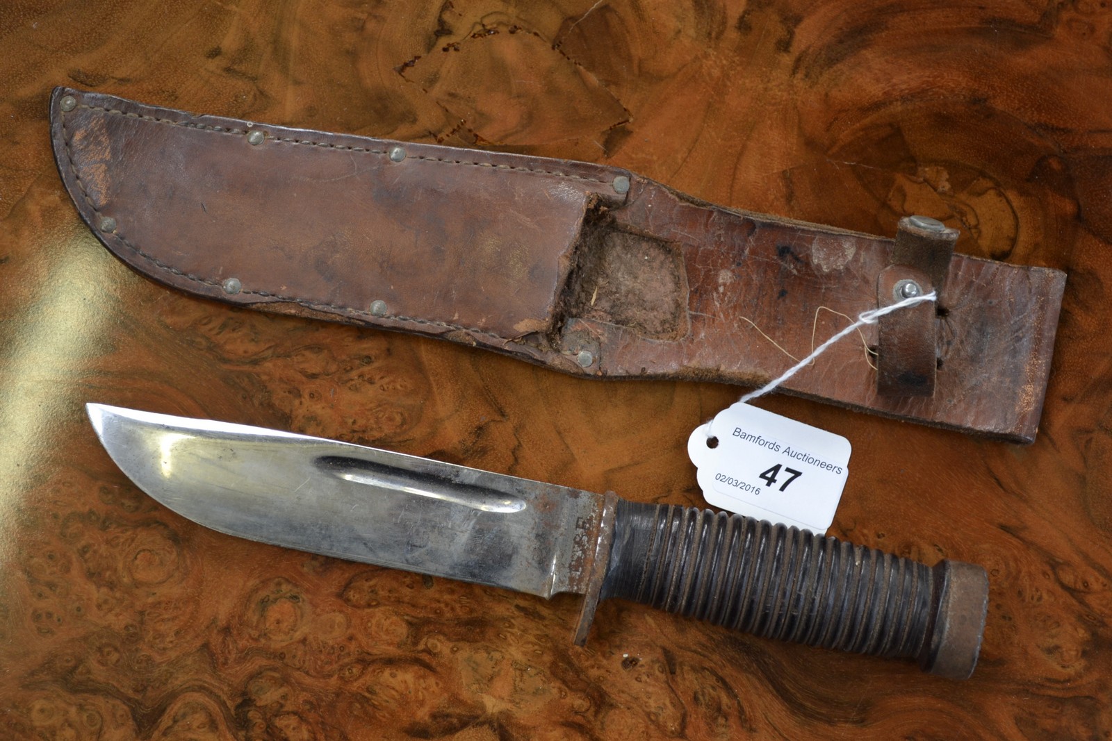 A WWII CASE 3376"Q quartermaster knife with original leather sheath.