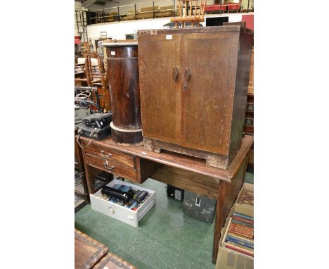 An oak draughtsman's desk, rounded rectangular top, two drawers to front, c.1940; a pigeon hole cabinet (2)