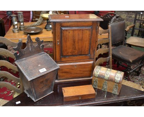 A 19th century oak candle box;  a Victorian wall mounting single door medicine cabinet;  a brass bound walnut dome top tea ca