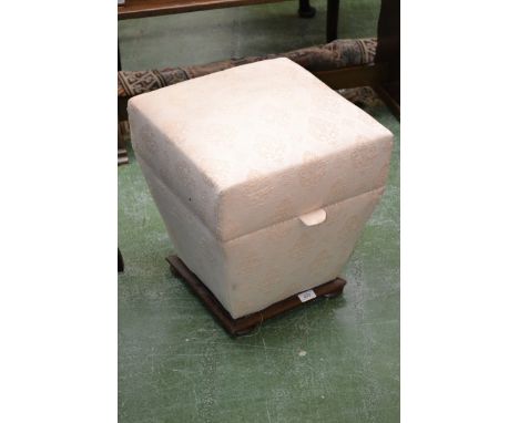 A Victorian pouffe, square hinged cover, tapering sides, bun feet. 44cm high x 41cm wide.