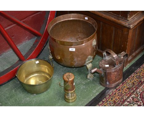 A Victorian copper water can; a brass jam pan; a miners lamp (3)