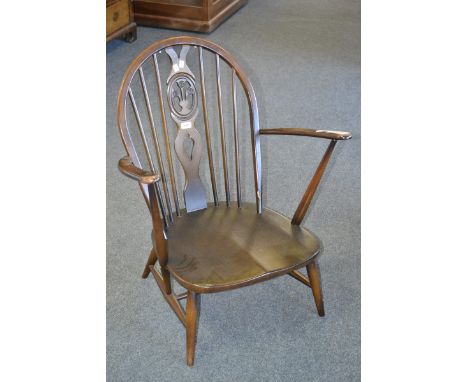 An Ercol wheel back chair