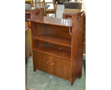 An Arts and Crafts mahogany open shelf book case..