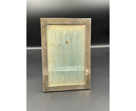 A silver easel backed picture frame, hallmarked for Birmingham 1925 by W J Myatt &amp; Co AF (Approx 16 cm x 10.5cm)