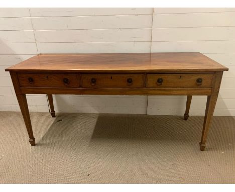 An inlay console table with tapering legs and three drawers (H76cm W165cm D59cm)