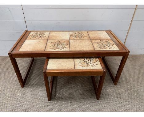 A Mid Century teak tile top coffee table with a nesting table to centre (H40cm W94cm D46cm)