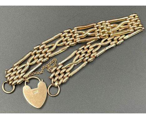 A 9ct gold gate bracelet with heart shaped fastener and safety chain (11.4g)