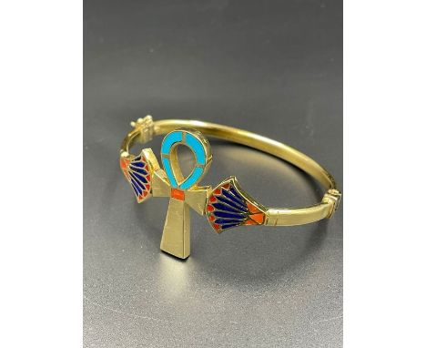 An Arabian gold bangle (Total Weight 19.4g) with enamel decoration.