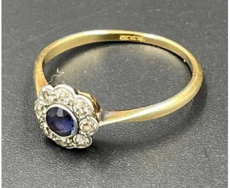 An 18ct gold sapphire and diamond daisy ring