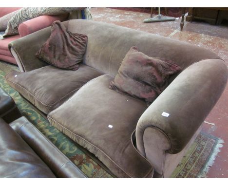 A roll-back brown velvet sofa 195cm wide 