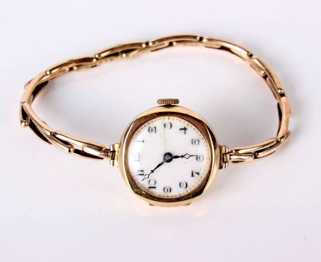 A 9ct gold ladies wristwatch, enamel dial (af), 15.7g in total