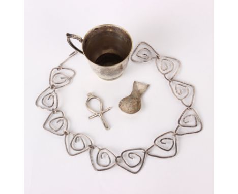 Silver; A Celtic cross, maker John Joyce, unhallmarked, a workshop piece, a caddy spoon, a necklace, a lid and an EPNS cup 