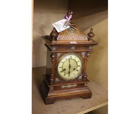 A Victorian style oak cased bracket clock.
