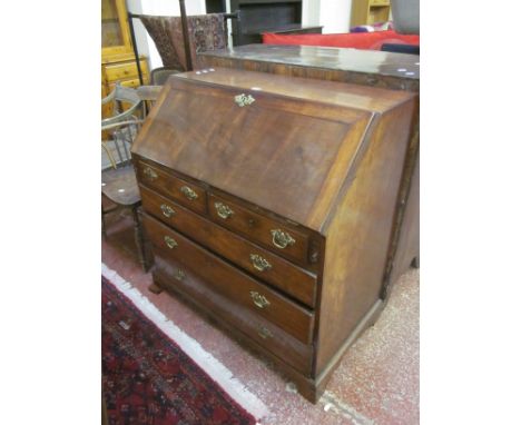 A George III mahogany bureau with a fitted interior, two short and three long drawers on bracket feet 100cm wide 