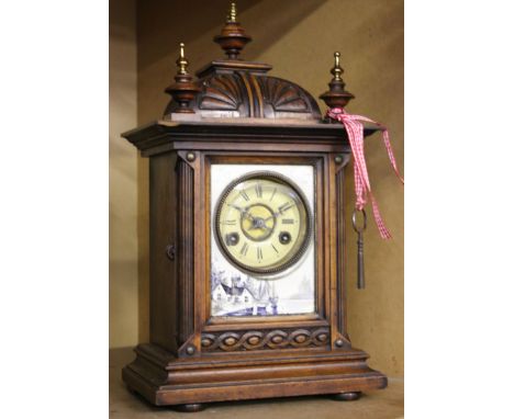 A Georgian style walnut cased bracket clock.