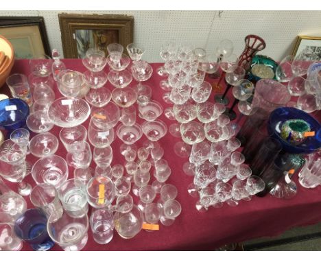 Large qty of glass incl. flutes, wine glasses, sherry glasses vases & coloured glasses