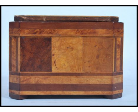 A 19th century VIctorian small walnut and sample wood marquetry tea caddy,&nbsp; of octagonal form, the removable cover, fron