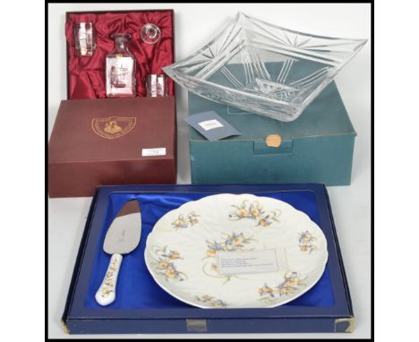 A good Wedgwood green glass candlestick holder in the Sheringham pattern being designed by Ronald Stennet Wilson together wit