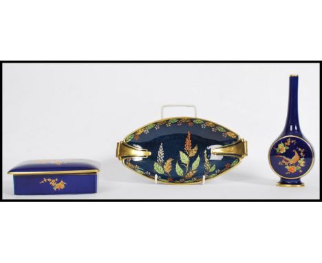 A group of three vintage 20th century Carlton Ware ceramic items to include a bud vase having a cobalt ground with gilt decor