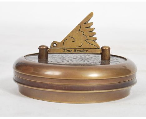 An unusual 20th century Gilbert Sundial - brass pocked cased sundial and compass being of roundel form with dials to borders 