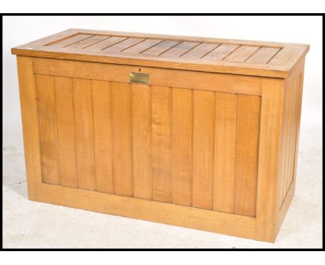 An unusual mid century large oak eclesiastical vestment - front chest coffer. Of light oak form with panelled design having a