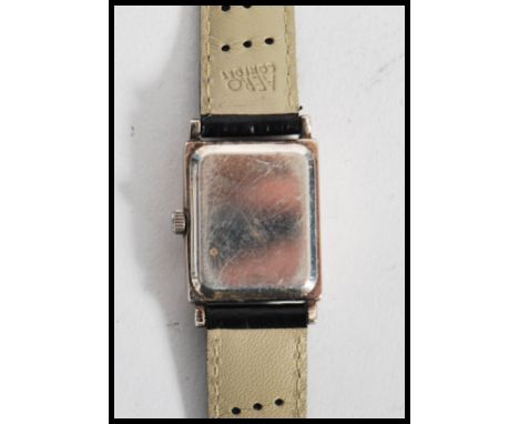 A vintage 20th century silver cased art deco wrist watch.The case of square form with silvered dial. Hallmarked to back.