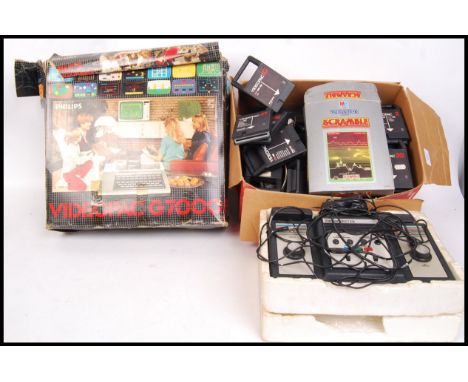 A vintage retro Philips Videopac G7000 console along with Visionscore set. Contents unchecked. Console within the original bo