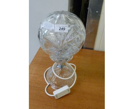 A modern lead crystal table lamp, having a spherical cut shade, on a pedestal foot  13''h        RAM