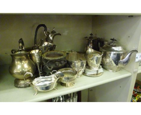 Metalware: to include a 1930s Art Deco inspired silver plated three piece tea set of oval demi reeded form, comprising a tea 