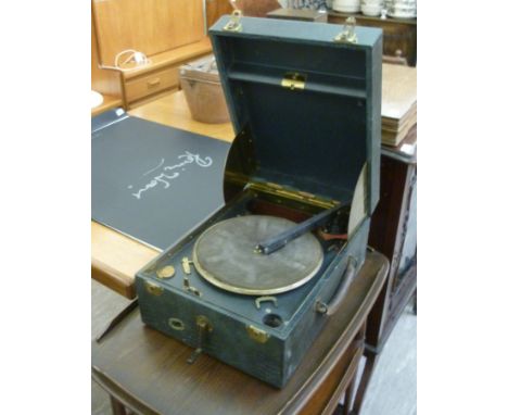 A mid 20thC unidentified table-top record player, in a simulated snakeskin covered case     RAB