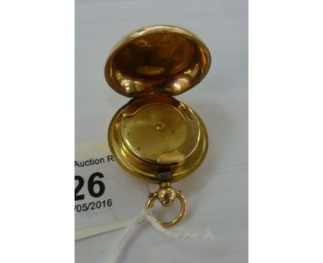 A 15ct gold hinged, fob design, pendant sovereign case, on a button clasp, enclosing a sprung clip         11 