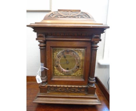AN IMPRESSIVE DOMED BRACKET CLOCK CARVED WOOD WITH 2 FLUTED COLOMNS, SILVERED CHAPTER RING WITH ARABIC NUMERALS. RINGS ON THE