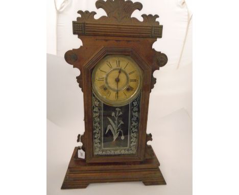 "GINGERBREAD" CLOCK IN WOOD CASE BY ANSONIA USA WITH ENGRAVED GLASS PANELS, STRIKING ON COIL 22" HIGH