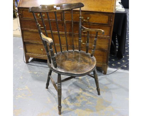 A 19th century elm stick-back country kitchen chair with circular seat and carved supports. Not available for in-house P&amp;