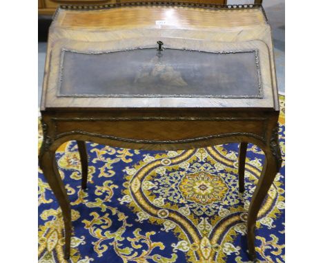 A 19th century French paquetry inlaid kingwood bonheur-du-jour, with drop-front decorated with a figural painted panel, fitte