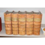 Five volumes Dickens works in pale red leather bin