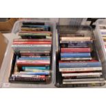 A collection of books, mostly modern hardbacks, Hi