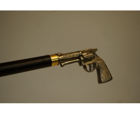 Walking stick with a handle in the form of a gun 
