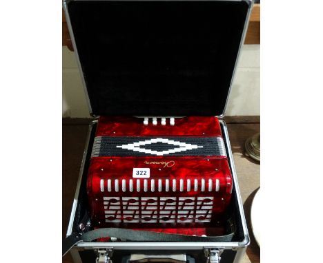 A Red Lustre Pearl Ware Cased Accordion