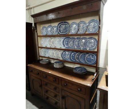 An Anglesey Oak Dresser Having A Three Shelf Rack, The Base Of Typical Construction Of Cupboards And Drawers 66" Wide