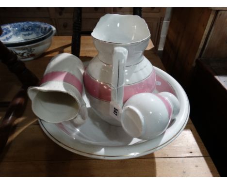 A Pink Banded Pottery Wash Jug And Basin Set