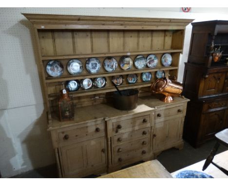 A Large Antique Pine Kitchen Dresser Having A Three Shelf Rack The Breakfront Base Having An Arrangement Of Cupboards And Dra