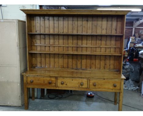 An Antique Stripped Pine Farmhouse Dresser Having A Three Drawer Base And A Two Shelf Rack, 79" Wide 81" High