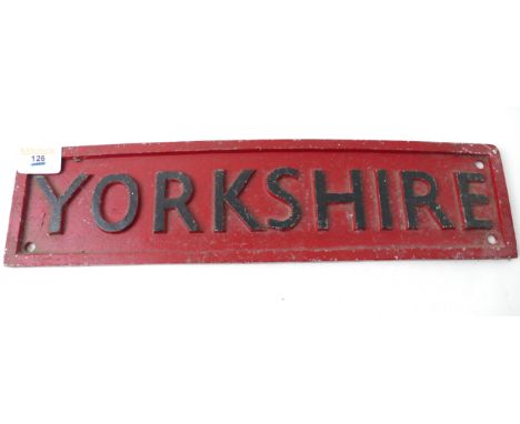 Two cast metal signs 'Yorkshire, measuring 48cm x 12cm and 'Yorkshire Engine Co Ltd' measuring 44cm x 19cm