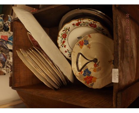 Box of meat plates and a cake stand