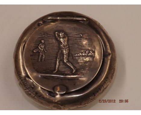 Golfing Interest: A silver snuff box, Chester 1912, the cover depicting a golfer in full swing