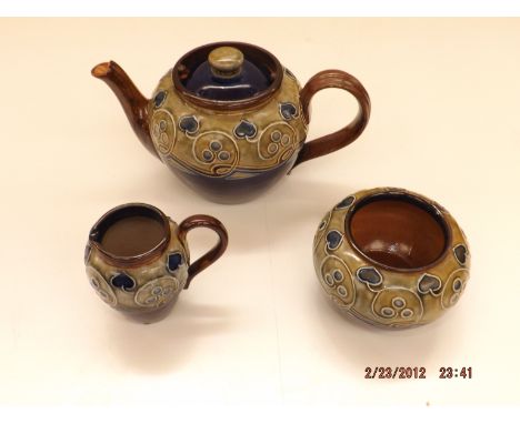 A Royal Doulton stoneware 3 piece tea service circa 1905, each piece with typical Art Nouveau sinuous decoration, impressed a