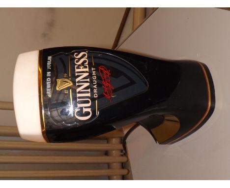 A Guinness pub lamp, working